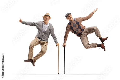 Two elderly men jumping with walking canes © Ljupco Smokovski