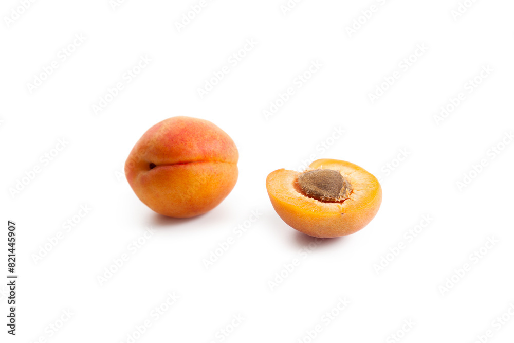 Apricot fruit whole and half isolated on white background.. Apricot fruit whole and half isolated on white background..