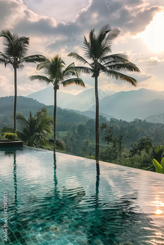 View from the infinity pool over the tropical jungle and green mountains.