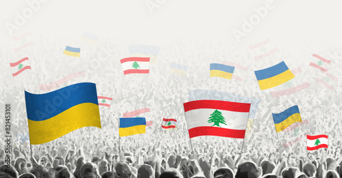 People waving flag of Lebanon and Ukraine, symbolizing Lebanon solidarity for Ukraine.