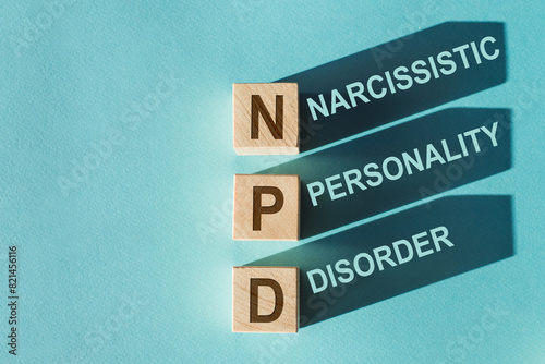 Three signs prominently display the words narcissistic, personality, and disorder in a clear and orderly manner. NPD