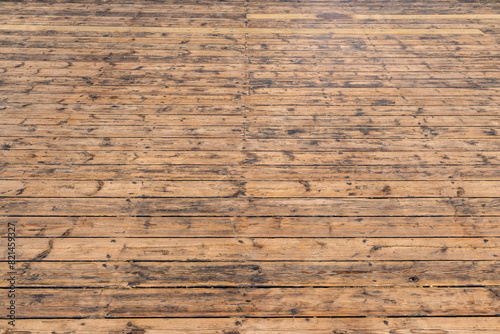 Natural brown parquet made of wooden panels in perspective