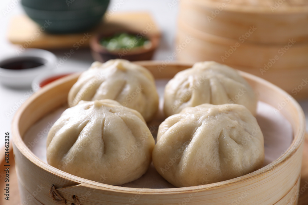 Delicious bao buns (baozi) on light table, closeup Delicious bao buns (baozi) on light table, closeup
