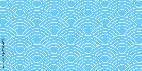 Blue and white Japanese seigaiha pattern. Sea or ocean waves background. Scallops print. Fish squama or dragon scale. Simple geometric ornament with round shapes. Vector graphic illustration.