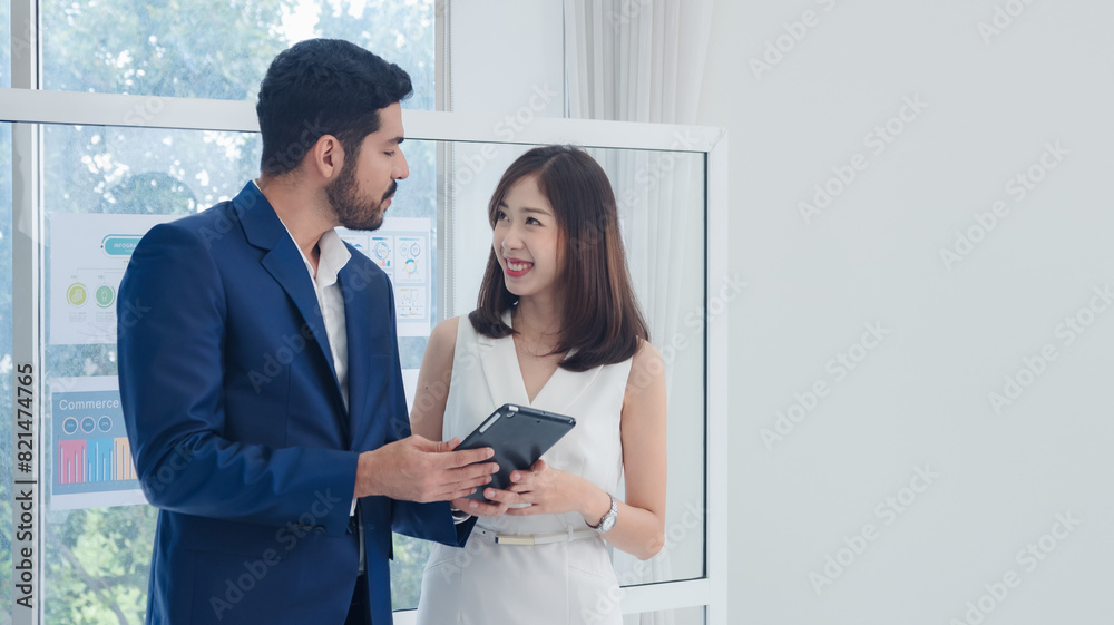 Portrait business team woman girl cute and man handsome Asian two people meeting standing looking hand holding laptop ready for presen creative idea job work success online sale inside office room. Portrait business team woman girl cute and man handsome Asian two people meeting standing looking hand holding laptop ready for presen creative idea job work success online sale inside office room.