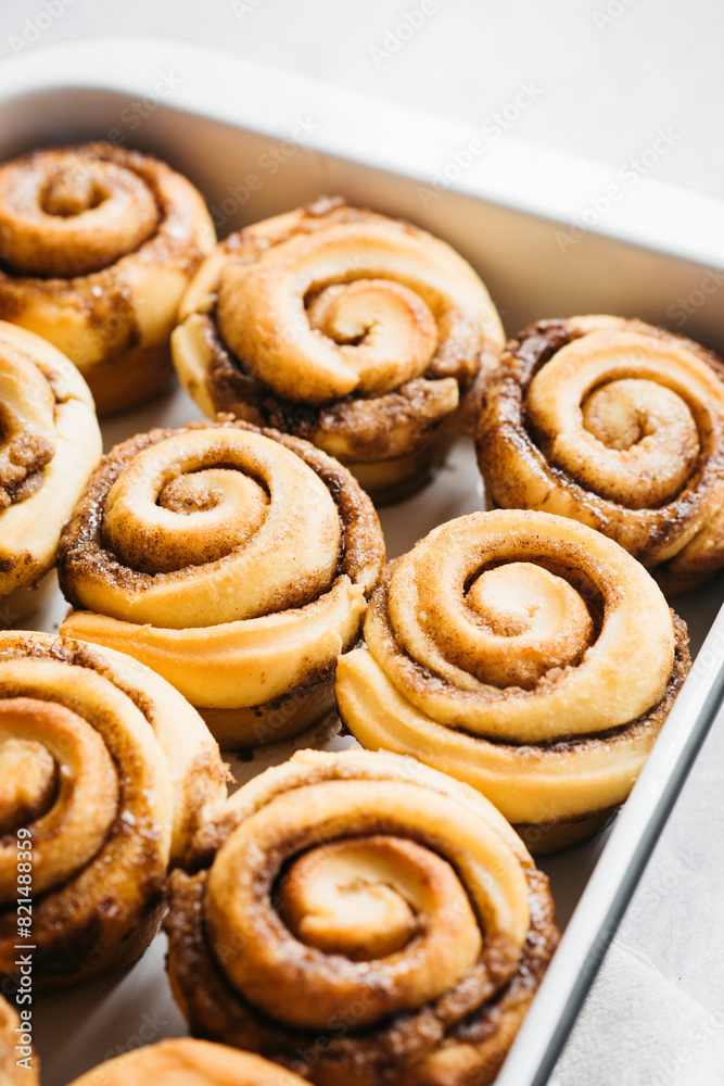 Cinnamon Buns baked in a dish on a bright background Cinnamon Buns baked in a dish on a bright background