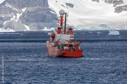 A Red Scientific Research Vessel Steaming Across the Seas, Antarctica Peninsula Near The Gullet, Adelaide Island