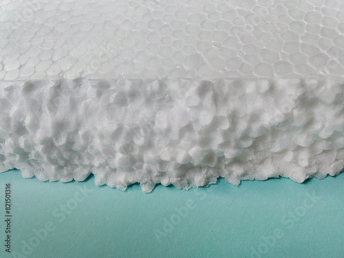 pieces of white styrofoam on blue cardboard.