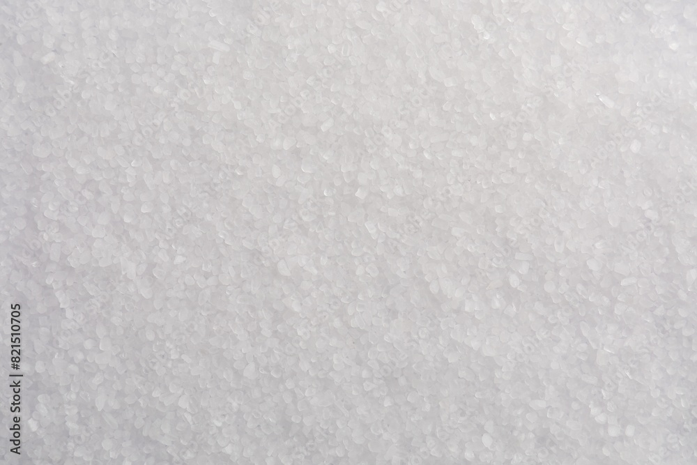 White natural salt as background, top view