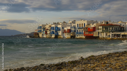 Colorful buildings along the ocean in Mykonos, Greece © A Beautiful World