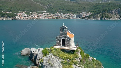 Sveta Nedelja is an islet on the Adriatic Sea, in Montenegrin municipality of Budva.  has a small church on it photo