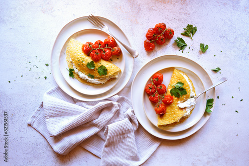 Gluten Free Crepes with Herb Ricotta and Roasted Truss Tomatoes. Horizontal Orientation. photo