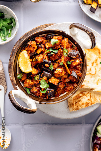 An aubergine bhaji, traditional Indian cuisine served with accompaniments photo