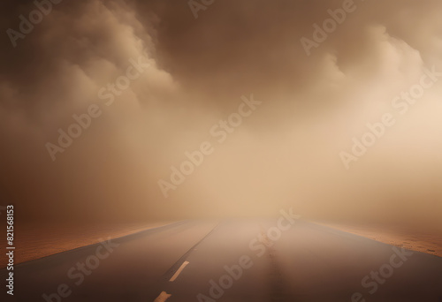 A deserted road disappearing into a thick, ominous fog with dramatic clouds overhead, creating a mysterious and eerie atmosphere.