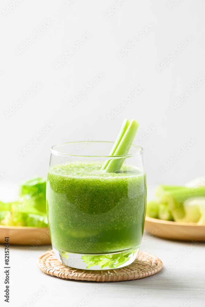 Celery green juice in glass on white background, Healthy drink for detox Celery green juice in glass on white background, Healthy drink for detox