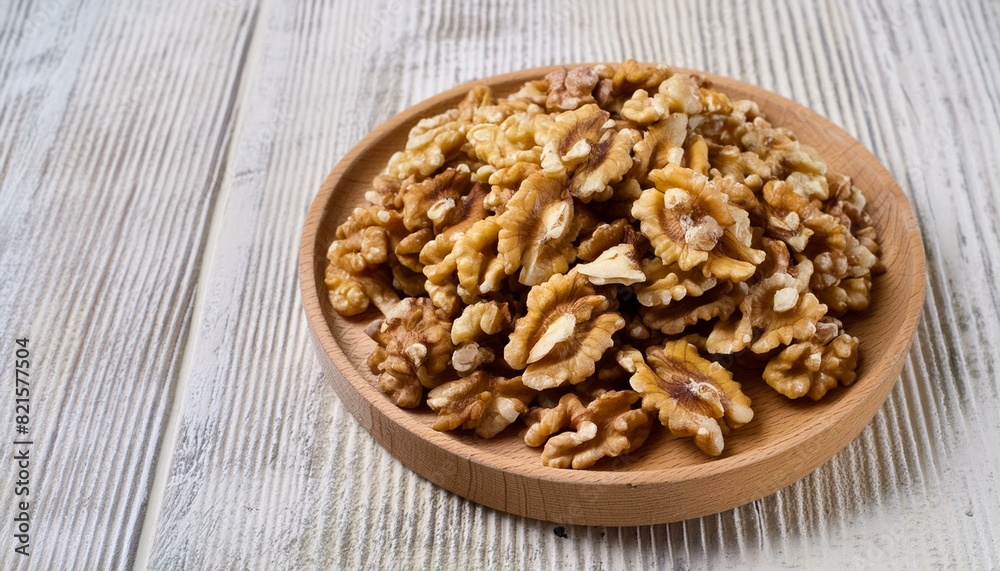 Wholesome Walnuts: Top View Close-Up on Wooden Plate Wholesome Walnuts: Top View Close-Up on Wooden Plate