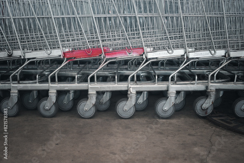 Close-up of a row shopping cart wheels. Concept of shopping