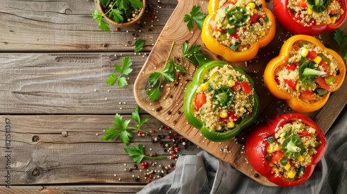 healthy quinoa stuffed bell peppers on rustic wooden board overhead view photo