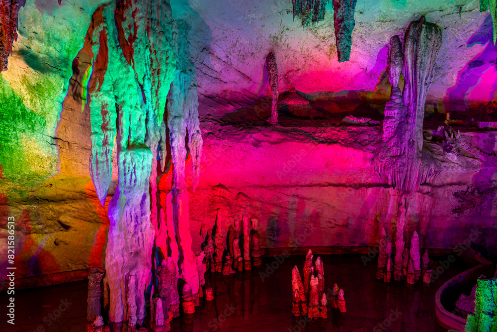 A natural cave in Guilin - China beautifully decorated with colorful lights
