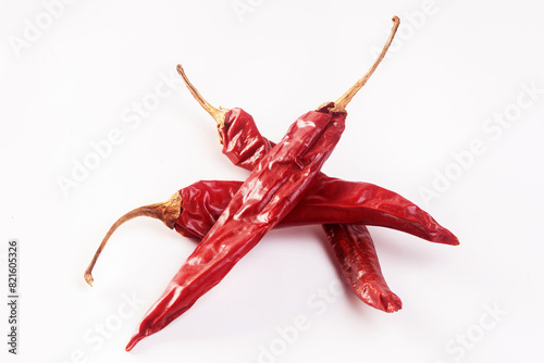 Foto Dried chilies isolated on white background