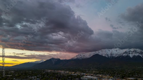 Sunset hyperlapse over Orem, Utah viewing Timpanogos mountain capped with snow. photo