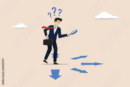 Finding success route, analyze to make decision choices, directions or pathway to success concept, businessman analyze career path with magnifying glass.