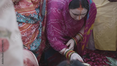 indian women praying to hindu almighty sun god at chhath festival photo