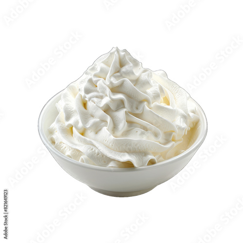 White whipped cream in a bowl isolated on white background