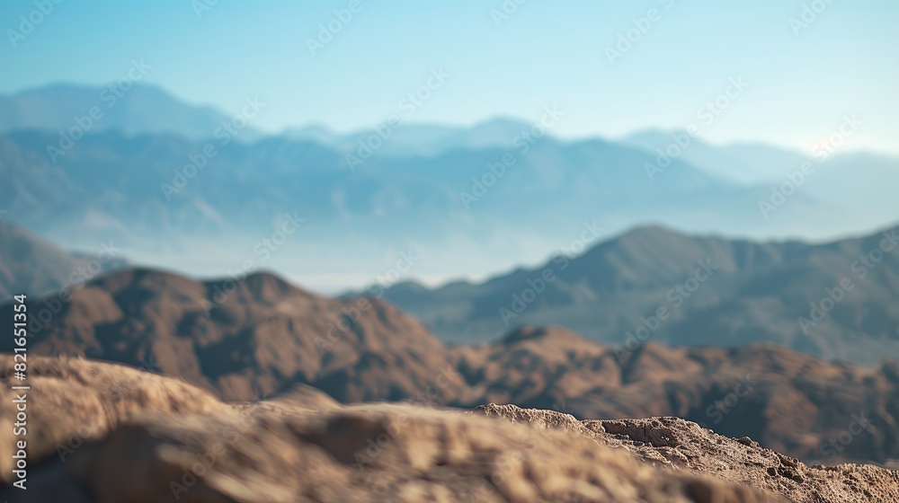 Naklejka premium Capture a bokeh photo of a picturesque desert with beautiful colors, featuring majestic mountains in the distance and a bright sky. The view is of superior quality and looks natural