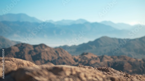 Capture a bokeh photo of a picturesque desert with beautiful colors  featuring majestic mountains in the distance and a bright sky. The view is of superior quality and looks natural