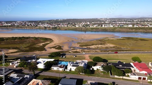 Aerial riser over Still Bay neighborhood reveals Goukou estuarine river photo