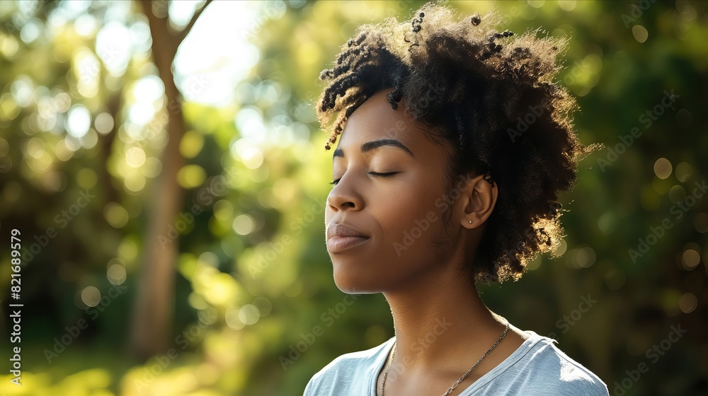 A woman with her eyes closed in the park. A woman with her eyes closed in the park.