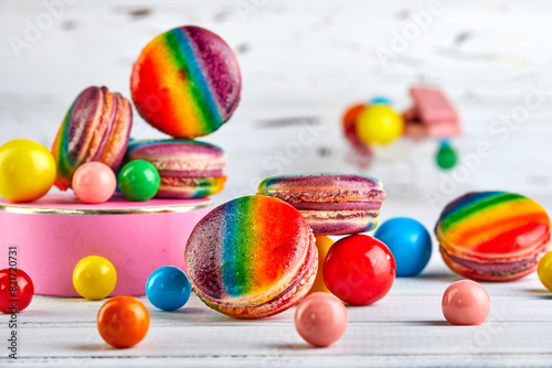 there are many different types of rainbow macaron, candy on the table
