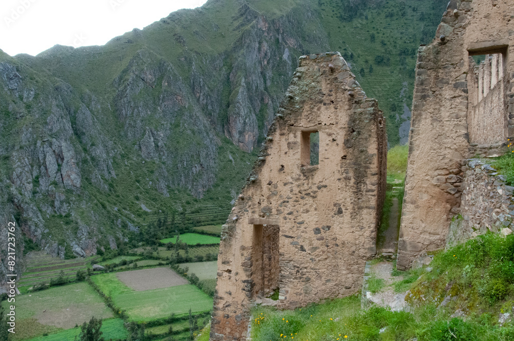 Inca ruins overlook terraced fields in the lush Peruvian Andes