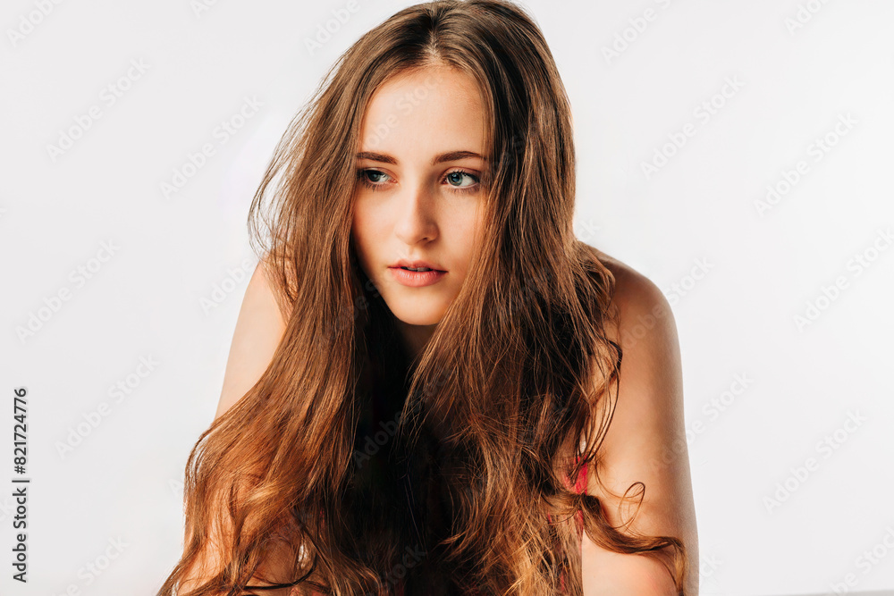 Naklejka premium High key studio portrait of teen girl with long hair