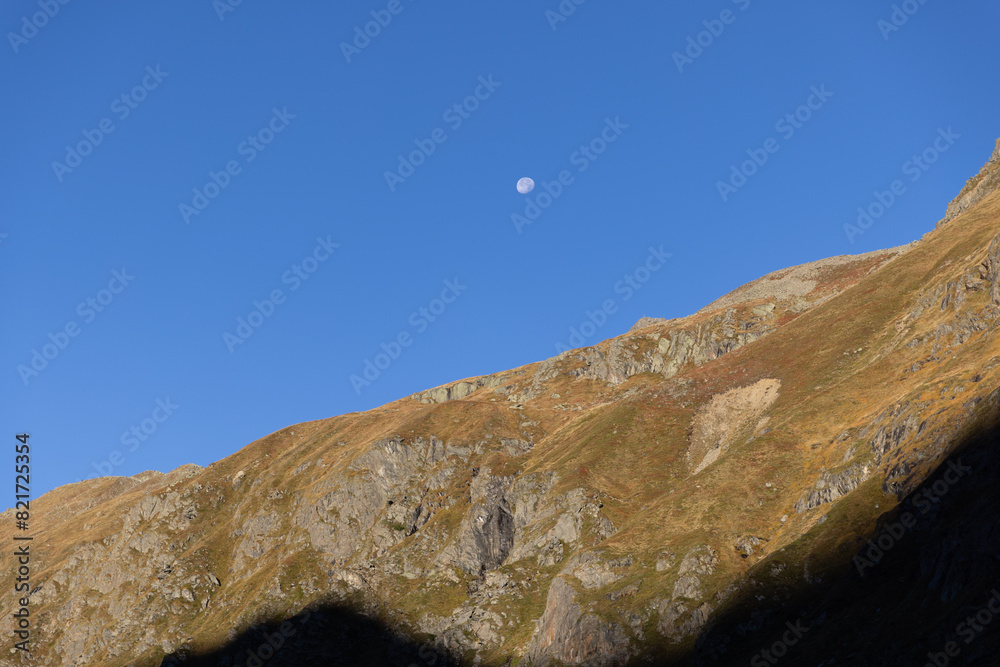 Daytime moon above the Stubai Alps in Tyrol, Austria Daytime moon above the Stubai Alps in Tyrol, Austria
