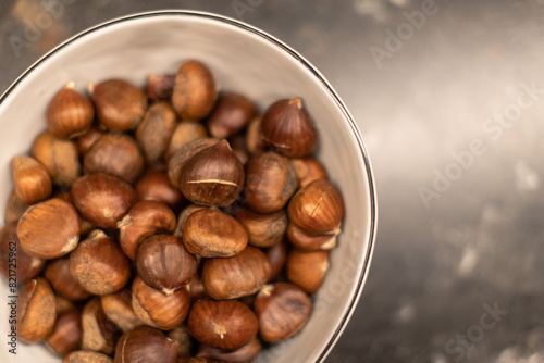 Bowl of fresh chestnuts, perfect for seasonal culinary uses.