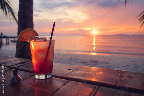 Tropical beach sunset with refreshing cocktail