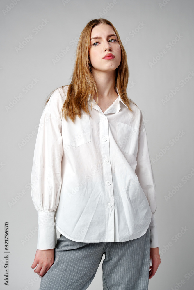 Young Woman Exhibiting a Pensive Sad Expression in a Studio Young Woman Exhibiting a Pensive Sad Expression in a Studio
