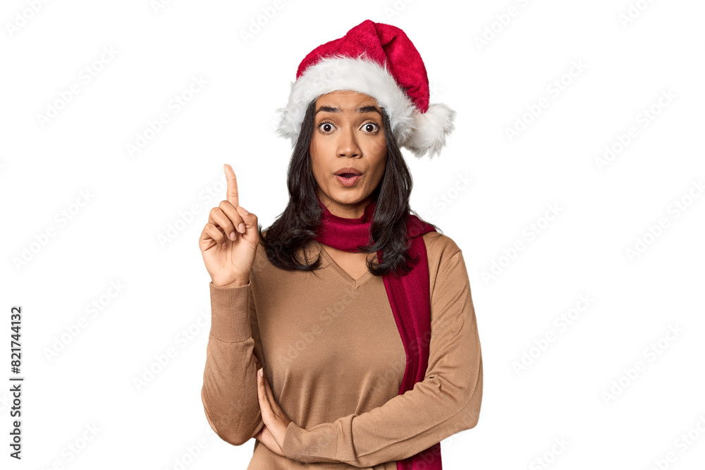 Filipino in Christmas attire and Santa hat having some great idea, concept of creativity. Filipino in Christmas attire and Santa hat having some great idea, concept of creativity.