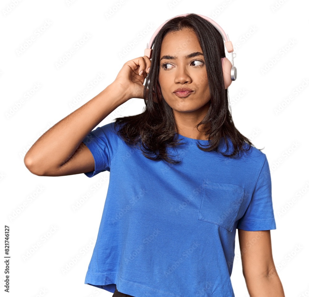 Joyful Filipino woman dancing with headphones Joyful Filipino woman dancing with headphones