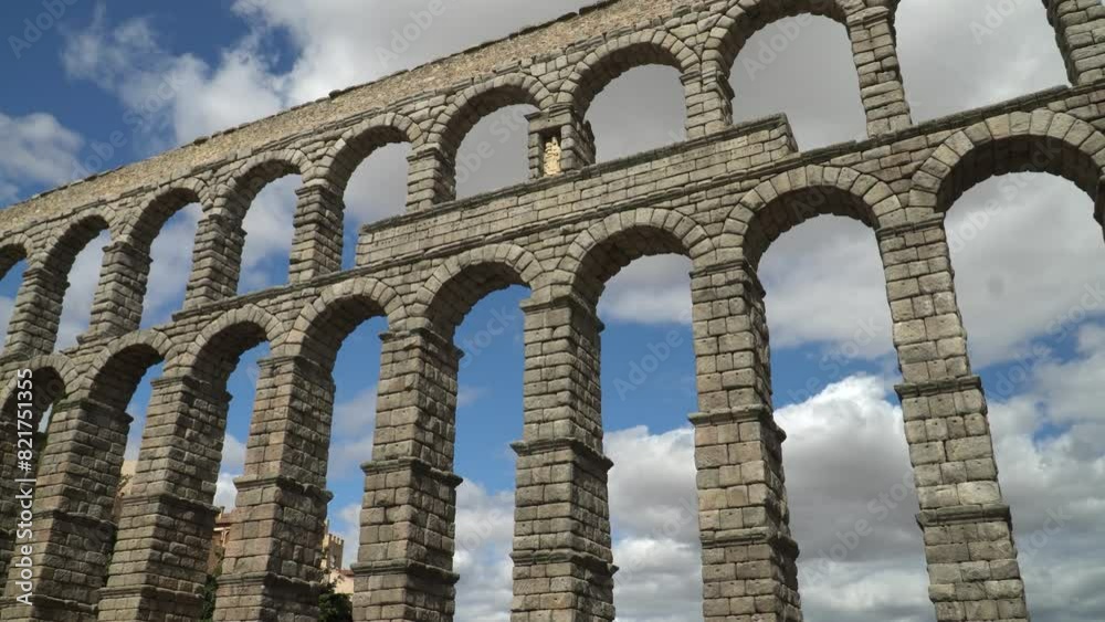 Ancient Roman aqueduct on Plaza del Azoguejo square and old building towns in Segovia, Spain Ancient Roman aqueduct on Plaza del Azoguejo square and old building towns in Segovia, Spain