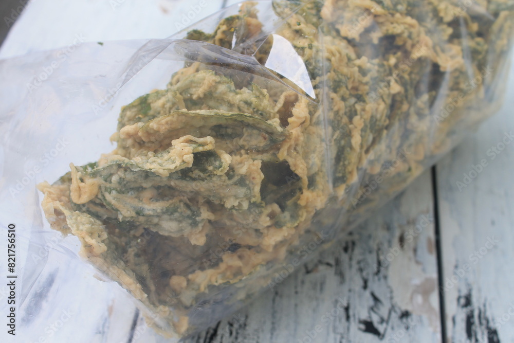 Spinach chips in plastic on the table
Spinach chips in plastic on the table