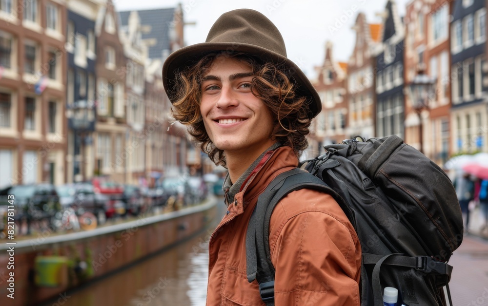 A young man wearing a hat and backpack walking on a busy city street A young man wearing a hat and backpack walking on a busy city street