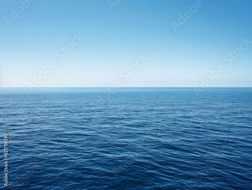 Serene ocean view with calm waves and a clear blue sky, symbolizing peace and tranquility.