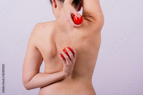 Female with tomatoes on her chest and back, concept of healthy food and female health