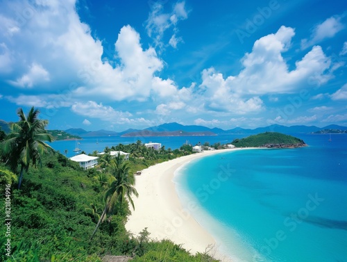 Scenic tropical beach with white sand, clear blue water, lush greenery, and a vibrant sky.