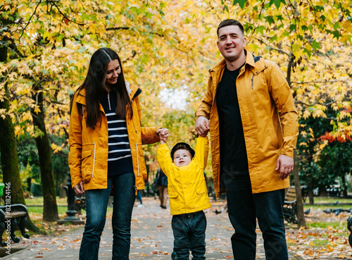 Portrait of a family in an autumn park.