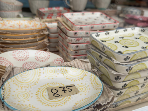 colorful Ceramic plates on shelf for sale