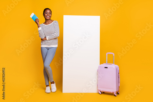 Full body photo of young lovely girl vacation check-in low-cost airport flight isolated over yellow color background photo